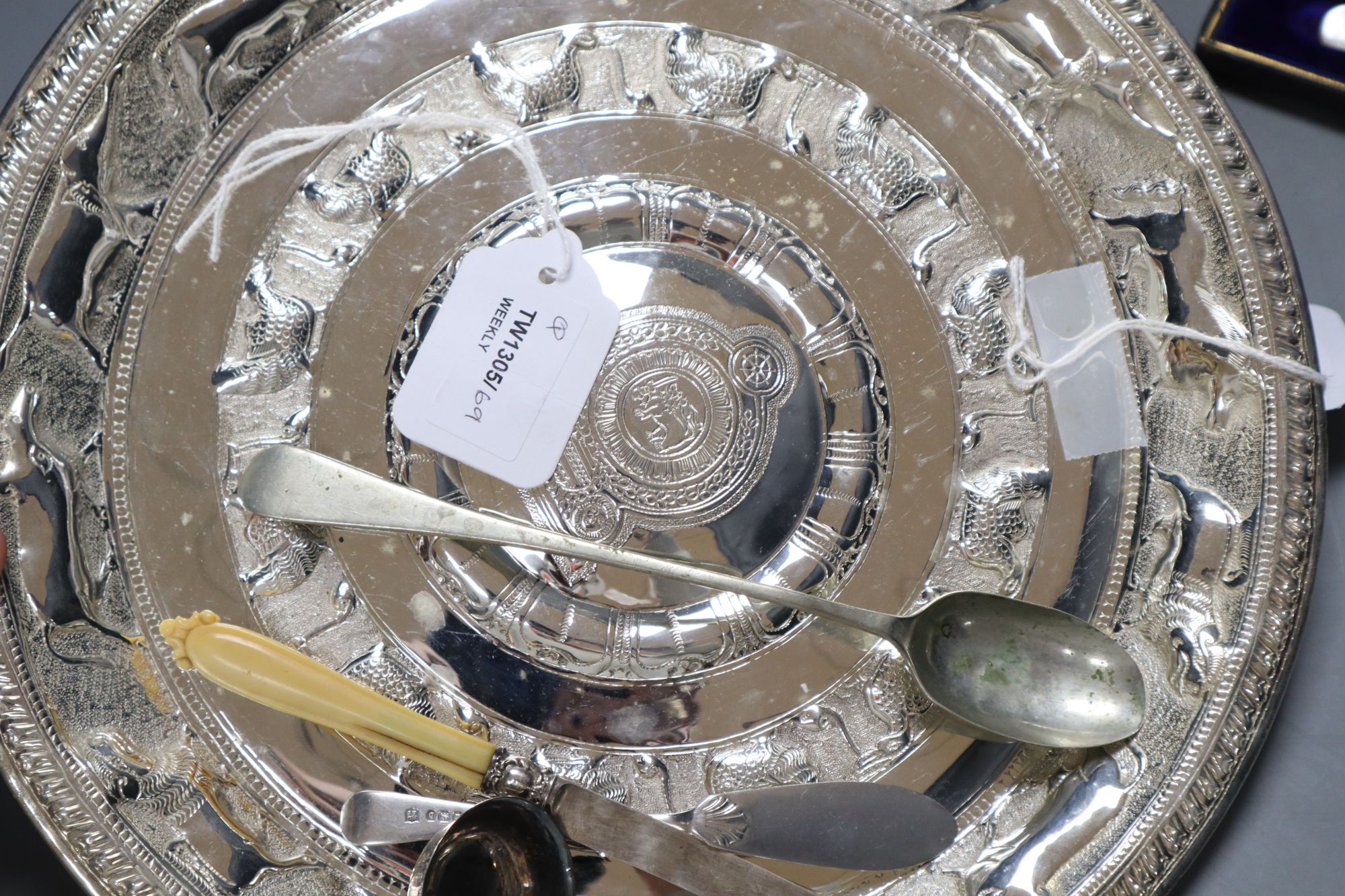 An Eastern embossed plated tray, a cased plated nut and grape set, a plated coffee pot, a silver sauce ladle and sundries